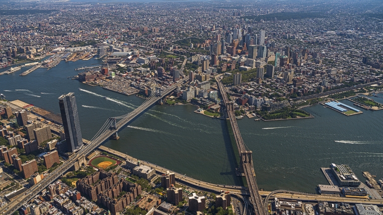 Panoramic aerial view of Two Bridges, Manhattan, Dumbo, Brooklyn, and Downtown Brooklyn from a helicopter.